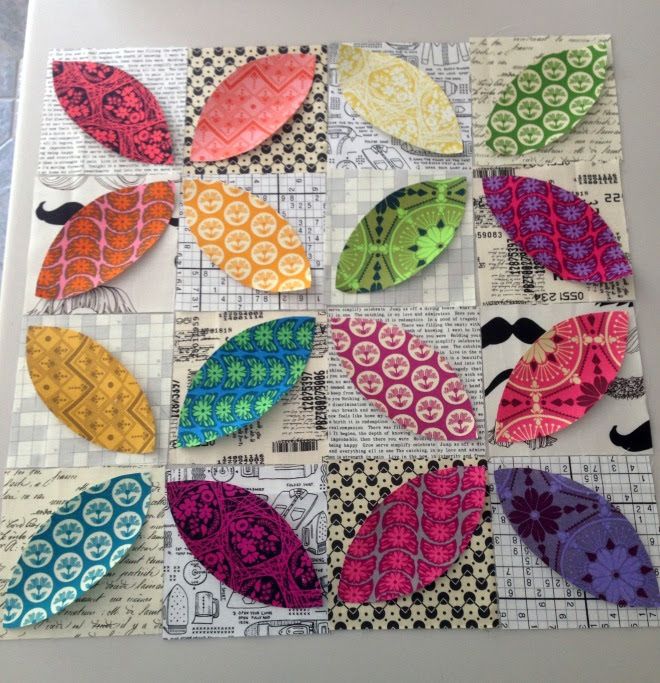 the paper pieces are laid out on top of each other, with different patterns and colors