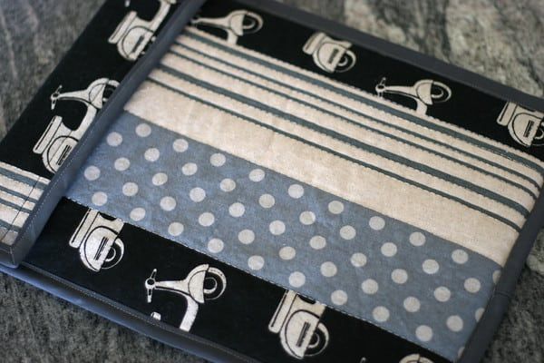 two trays with black and white designs on them