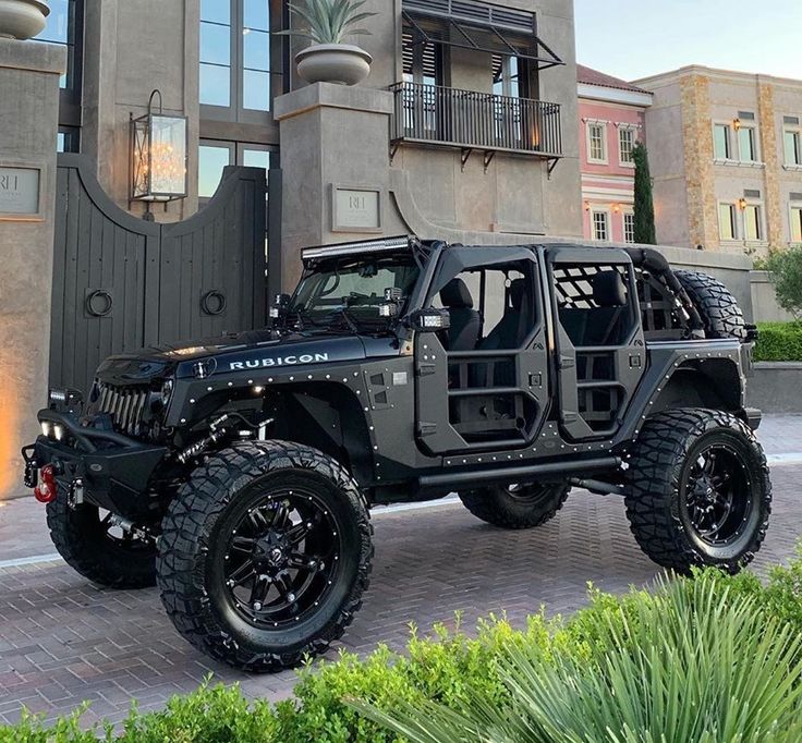 a black jeep parked in front of a building