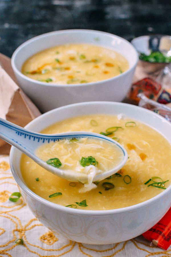 two bowls filled with soup on top of a table