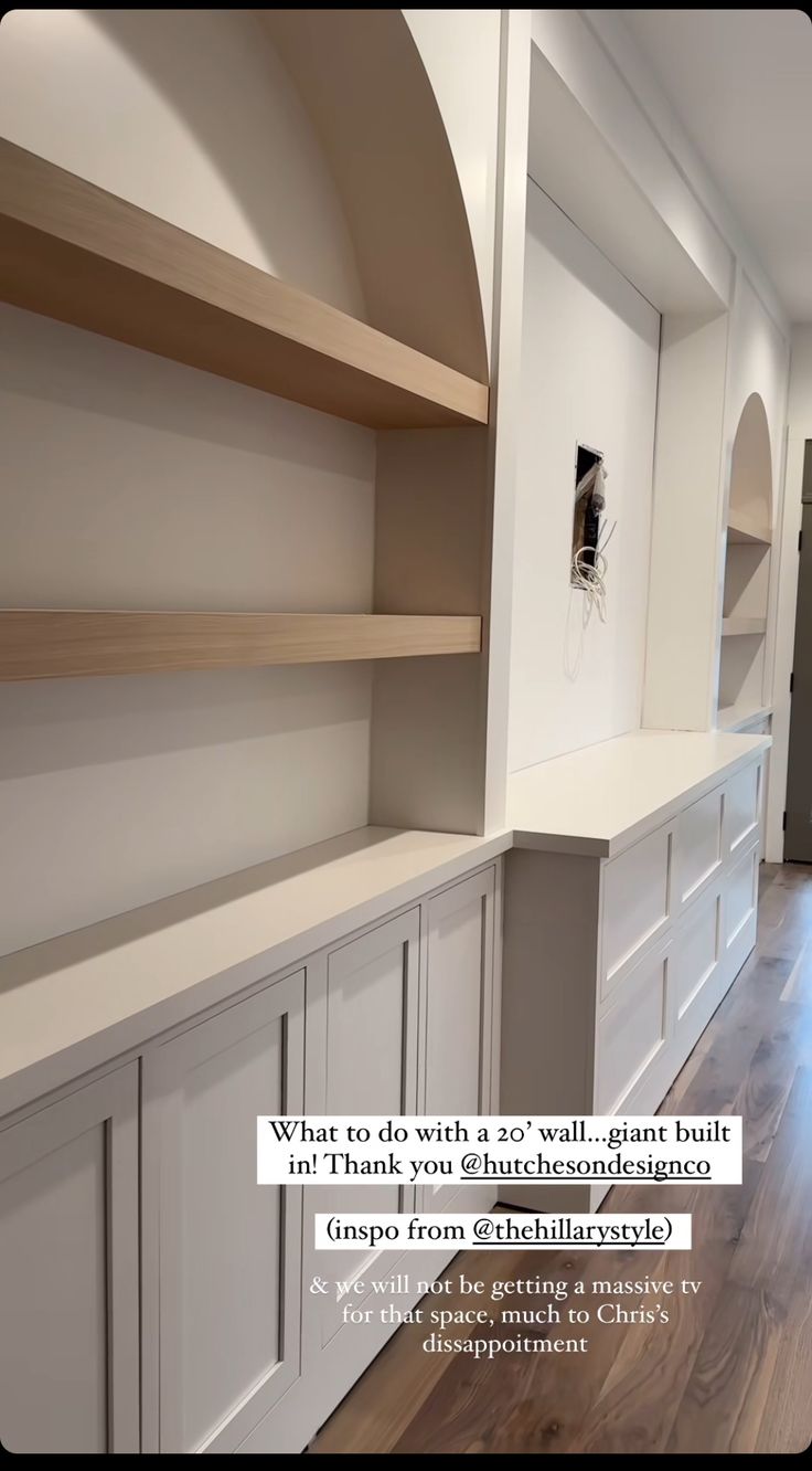 an empty room with built in shelving and wood flooring is featured for the ad