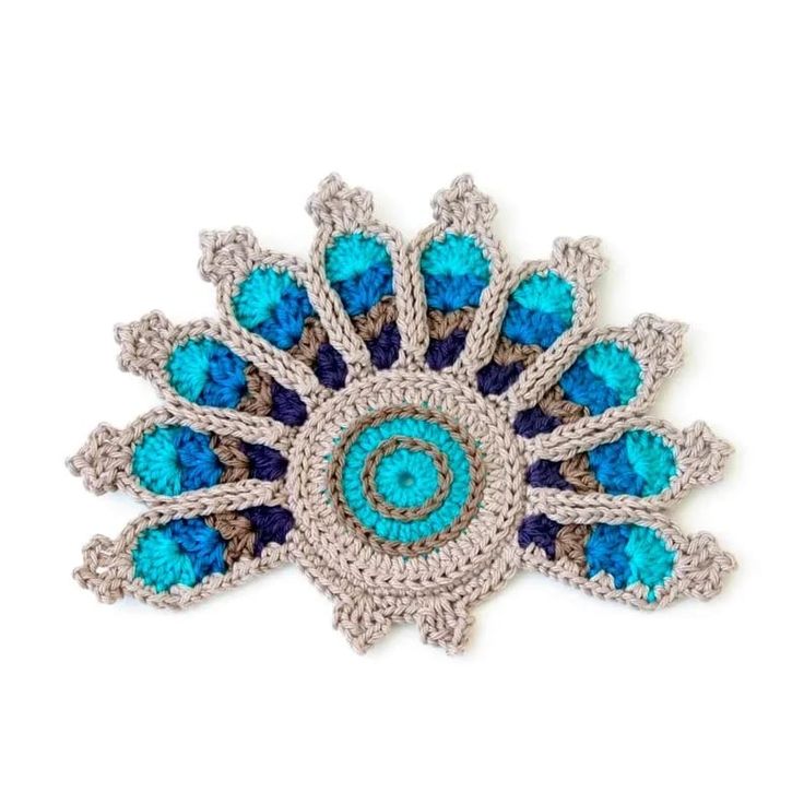 a brooch with blue and white stones on it