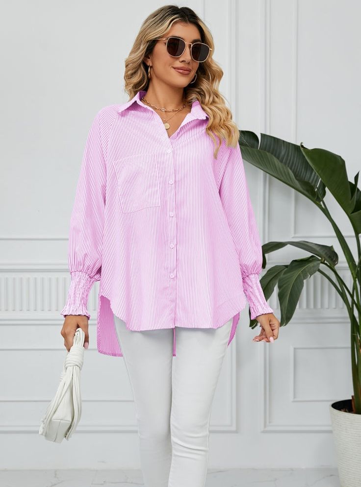 Embrace the new season with flair in this striking striped oversized linen-inspired shirt. Crafted from a stone-toned linen-like fabric featuring a stylish striped pattern, this shirt offers a button-down front and a comfortable oversized fit. Pair this versatile linen-inspired shirt with a chic bralette, your go-to jeans, and sleek slides to create an effortlessly fashionable everyday ensemble that's sure to turn heads. Fabric name: polyesterStyle: cardiganSleeve length: long sleevesTechnology: pleatingVersion: bat typeLength: medium length (65cm < length ≤80cm)Collar type: lapelPopular elements: wrinklesColor: blue, pink, blackSize: S,M,L,XL,XXL Spring Button-up Tops With Horizontal Stripes, Spring Oversized Blouse With Striped Collar, Oversized Striped Spring Blouse, Oversized Blouse With Striped Collar For Spring, Oversized Striped Blouse For Spring, Spring Horizontal Stripe Collared Shirt, Spring Horizontal Stripe Button-up Shirt, Spring Button-up Shirt With Horizontal Stripes, Trendy Oversized Striped Blouse