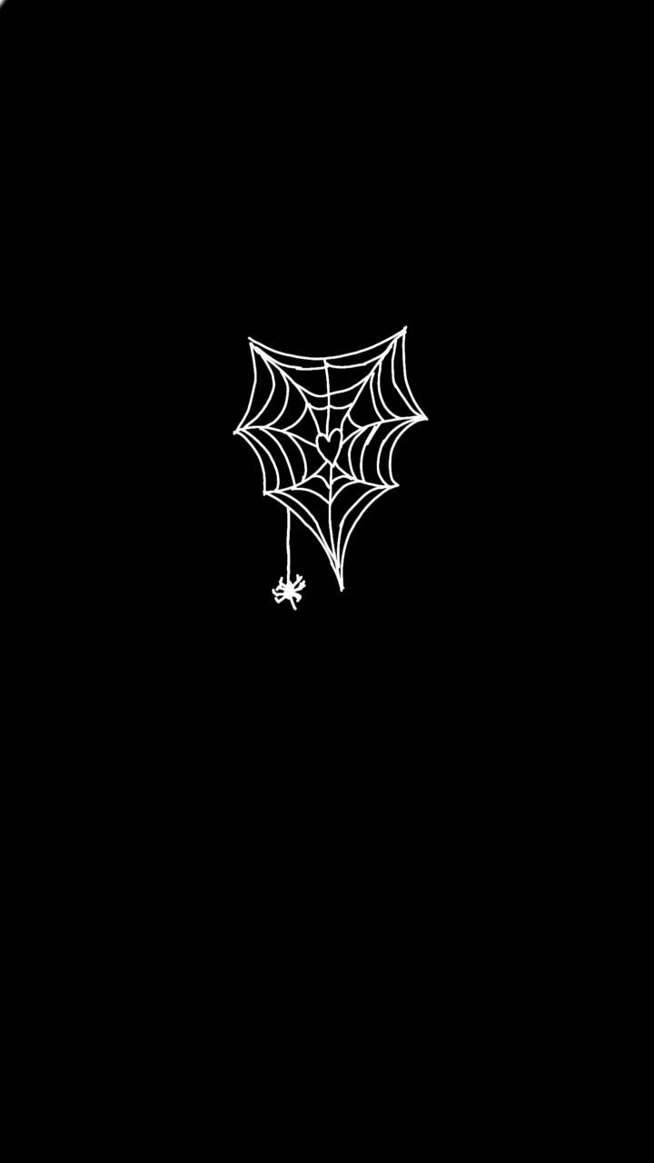 a black and white image of a spider web on a dark background with the word halloween written across it