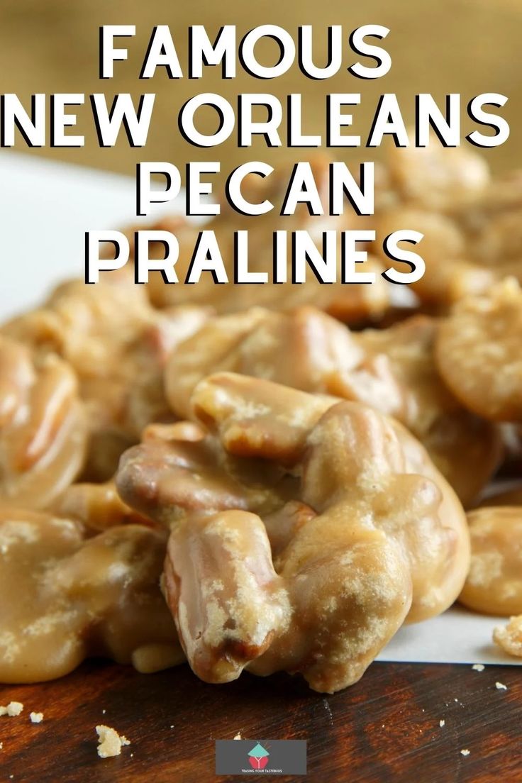 a pile of new orleans pecan pralies sitting on top of a wooden cutting board