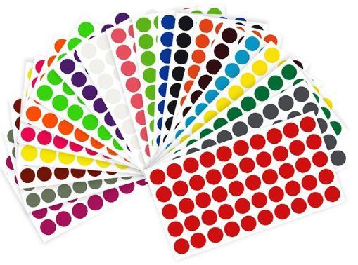 several colors of polka dot stickers are arranged in the shape of a fan on a white background