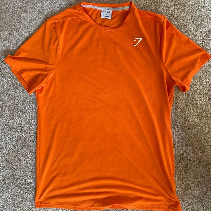 New Without Tags! It Has Never Been Worn, So No Signs Of Wear Or Tear. Color-Orange Size-Small Orange Crew Neck Sports Top, Orange Sporty Crew Neck Top, Sporty Orange Crew Neck Shirt, Casual Orange Moisture-wicking Tops, Casual Workout Orange Tops, Casual Workout Tops In Orange, Casual Orange Workout Tops, Sporty Orange Short Sleeve Tops, Orange Short Sleeve Workout Top