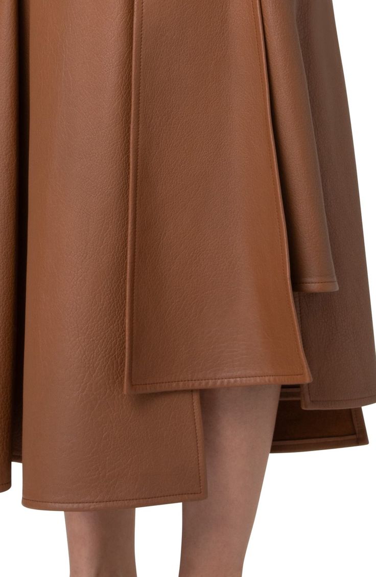 The brand's tailoring expertise is apparent on this asymmetric lambskin-leather skirt with slanting seams always angling toward signature trapezoid shapes. Hidden side-zip closure Hidden side-zip pocket Leather Professional leather clean Made in Switzerland Designer Clothing Modern Leather Pencil Skirt, Brown Leather Flared Skirt, Designer Leather Skirt For Work, Formal Brown Leather Skirt, Luxury Leather Skirt, Designer Fitted Leather Skirt, Formal Leather Flared Skirt, Formal Flared Leather Skirt, Formal Knee-length Leather Skirt