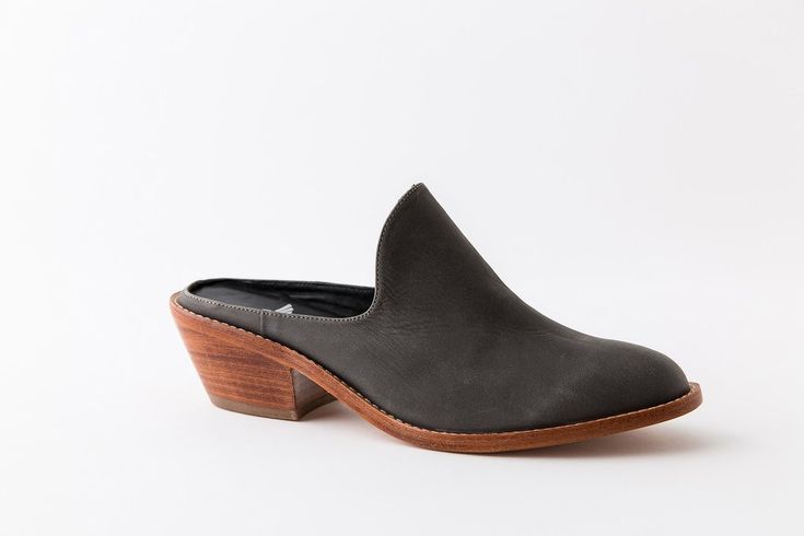 Classic Mules With Contrasting Heel Counter, Slip-on Low Heel Leather Mules, Leather Low Heel Slip-on Mules, Leather Slip-on Mules With Low Heel, Elegant Spring Clogs With Leather Sole, Chic Leather Sole Almond Toe Mules, Classic Almond Toe Mules With Contrasting Heel Counter, Chic Leather Sole Mules For Work, Chic Almond Toe Mules With Leather Sole