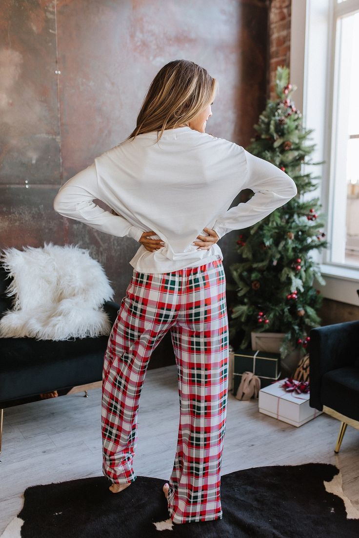 Wrap up in cozy and festive style this season with this Merry Christmas Plaid Pajama Set. Crafted from soft and breathable fabric, its classic plaid design adds a touch of elegance and style to your holiday look. Enjoy festive nights with family and friends in this stylish pajama set, available in sizes S-XL. Model Info: Models are 5'7", Size 2, wearing smalls Fabric: 70% Polyester + 27% Viscose + 3% Elastane Sizes Bust Waist Hem_Width Shoulder Sleeve_Length Length Hip Bottoms Inseam Outseam Relax Relax Relax Relax Relax Relax Relax Relax Relax Relax S 43.3 26.4 44.1 21.3 20.5 22.8 40.2 25.8 29.4 41.3 M 45.7 28.3 46.5 22.4 20.9 23.6 42.5 27.2 29.5 41.7 L 48.0 30.3 48.8 23.6 21.3 24.4 44.9 28.5 29.6 42.1 XL 51.2 33.1 52.0 25.2 21.7 25.2 48.0 30.3 29.6 42.5 Elasticity High December Colors, Simple Christmas Outfits, Holiday Fits, Stylish Pajamas, Trendy Christmas Outfits, Plaid Pajama, Buffalo Plaid Pattern, Christmas Pajama Set, Christmas Pjs