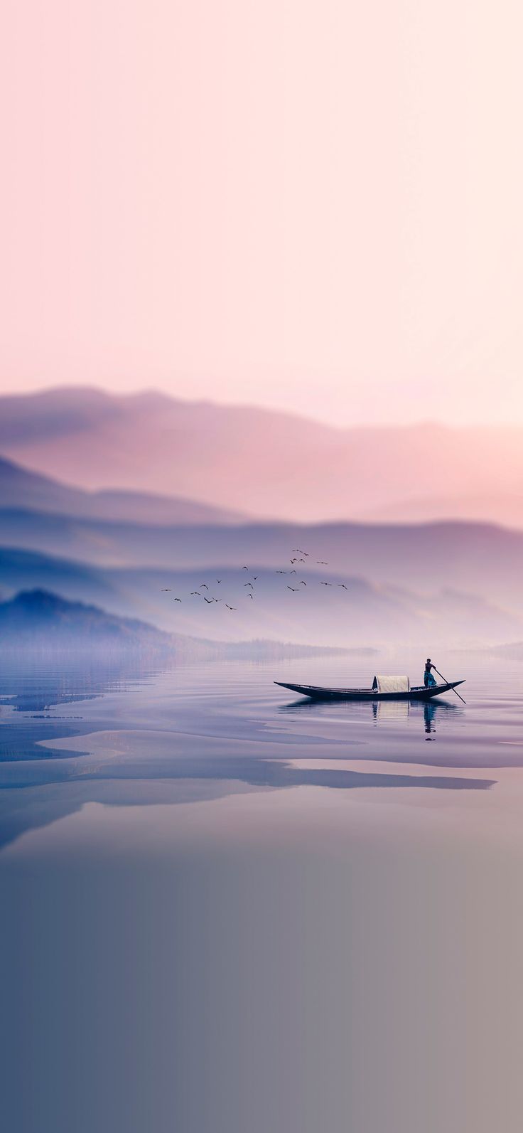 a man in a boat on the water with birds flying over it and hills behind him