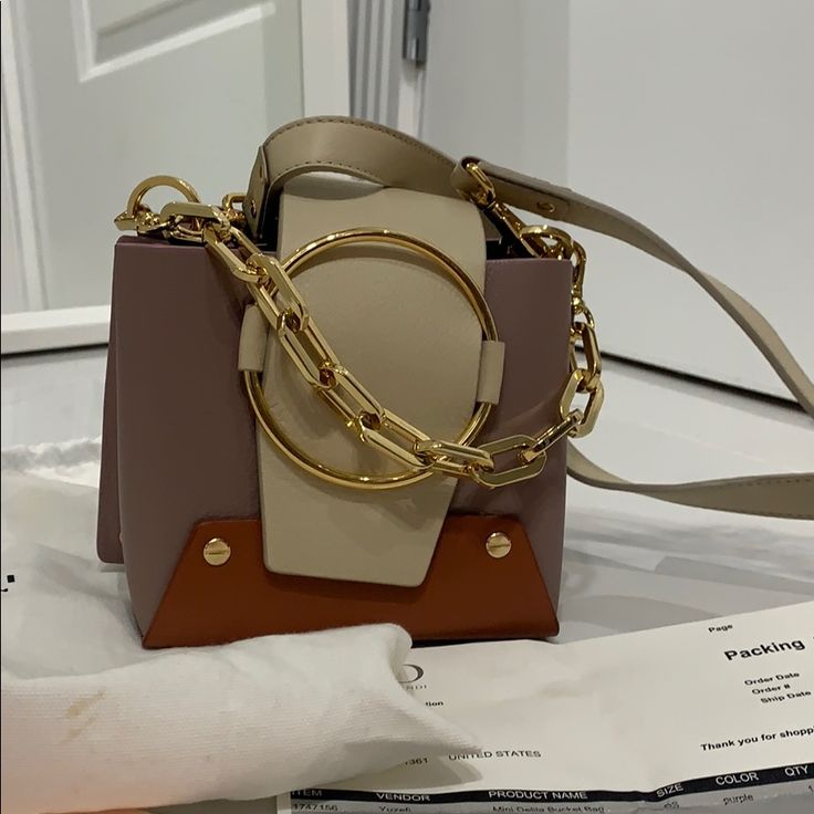 Like Brand New From Moda Operandi Website Yuzefei. Please Check Online Size Mini Delilah Bucket Bag One Size Purple $479 Formal Rectangular Bucket Bag With Chain Strap, Top Handle Box Bag With Removable Pouch, Designer Square Bucket Bag With Detachable Strap, Gold Box Bag With Detachable Strap, Chic Gold Bucket Satchel, Elegant Gold Bucket Satchel, Designer Satchel With Chain Strap For Shopping, Designer Gold Bucket Shoulder Bag, Chic Bucket Evening Bag With Handles