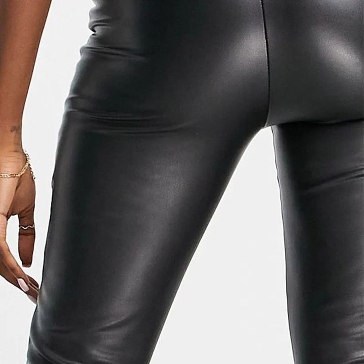 Discover the essence of sleek and modern style with our Sleek High-Waist Stretch Pencil Trousers. These trousers are a perfect blend of casual elegance and comfortable wear, suitable for all seasons. The high waist design not only adds a touch of sophistication but also provides a flattering fit for various body types. Crafted with a medium stretch fabric, these trousers ensure both comfort and a figure-hugging silhouette. The PU faux leather material, combined with spandex, offers a luxurious feel and a flexible fit, making these trousers ideal for day-long wear. Featuring a solid pattern and a classic pencil pant style, these trousers are a versatile addition to your wardrobe. Whether it's a day at the office or a casual evening out, these trousers adapt effortlessly to any setting. The Modern High Waist Leather Pants, Trendy Leather Pants For Work, Sleek High Waist Leggings, Sleek High Waist Elastane Leggings, Sleek High-waist Elastane Leggings, Chic High Waist Tight Leggings, Straight Leg Leggings For Night Out, Chic High Waist Leggings, Sleek Leather Pants For Going Out