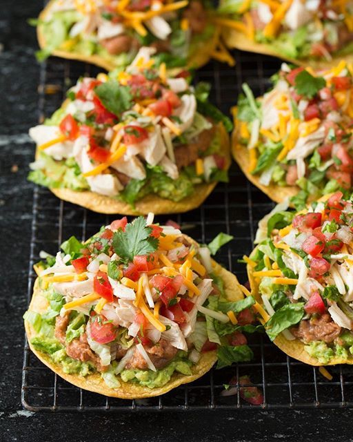 several tacos are sitting on a cooling rack