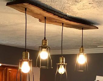 three light bulbs are hanging from the ceiling