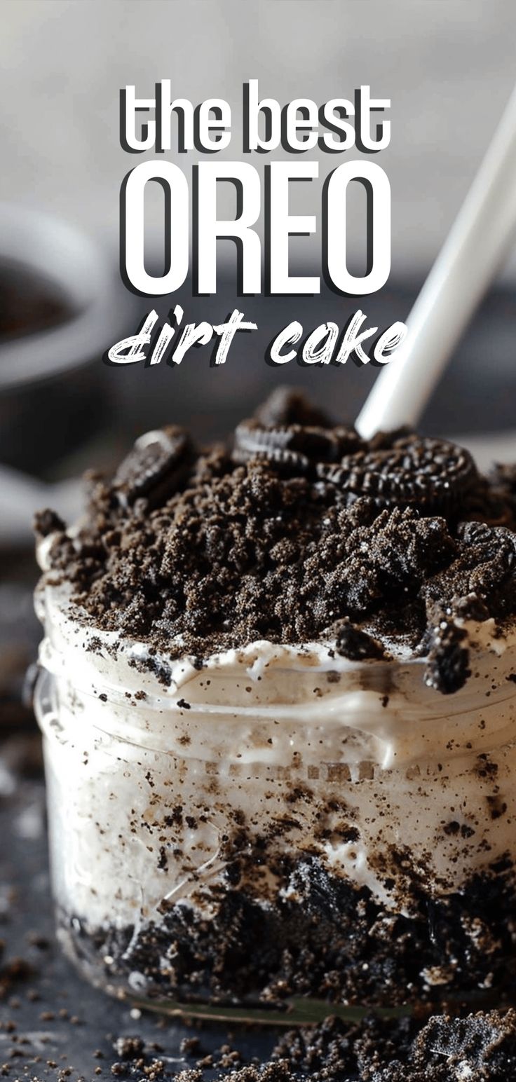 the best oreo dirt cake is in a glass jar with a spoon on top