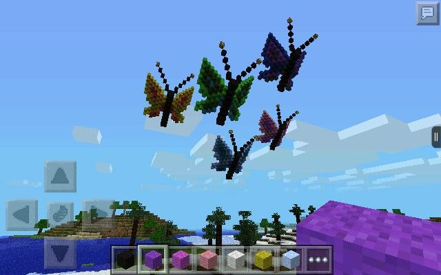 an image of some butterflies flying in the sky