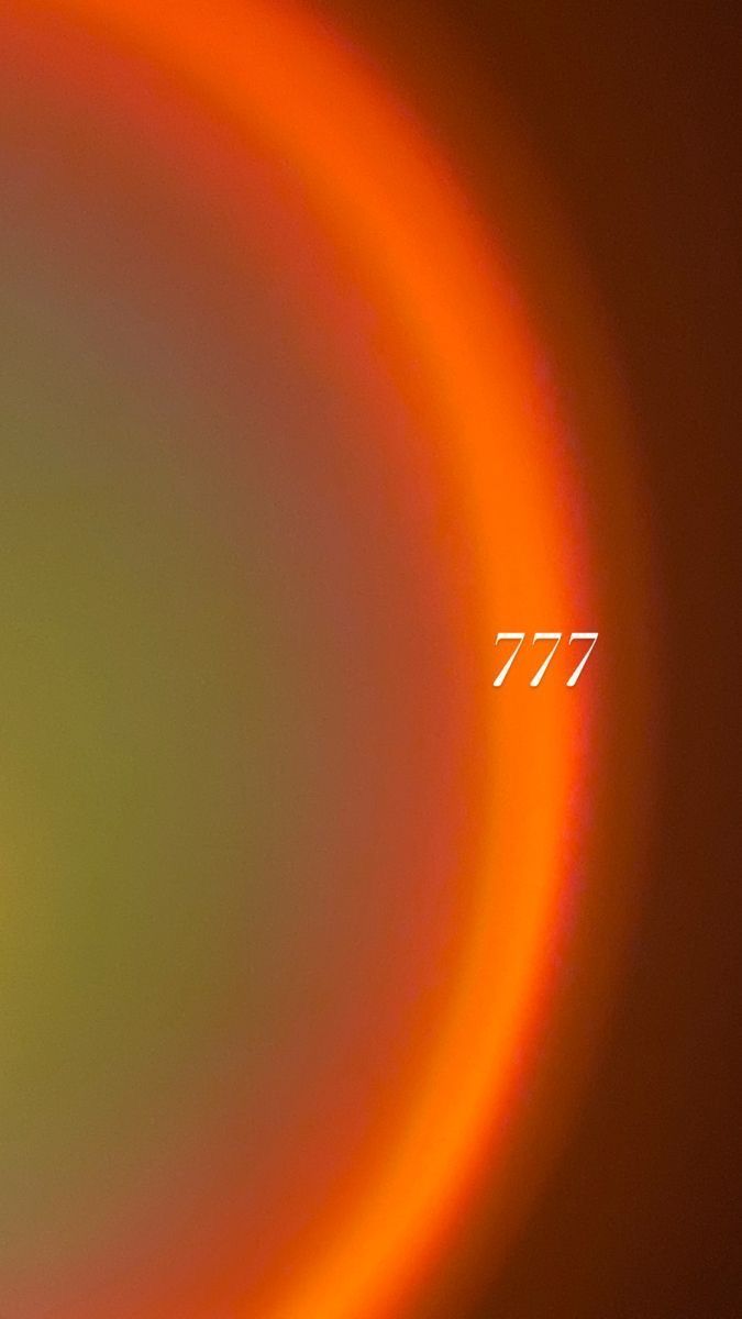 an orange and yellow circle with the word 777 on it