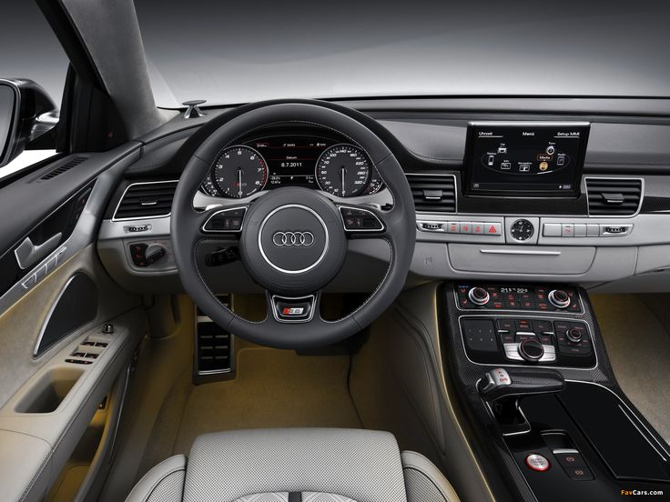 the interior of an audi car with dashboard and infotains, including electronic devices