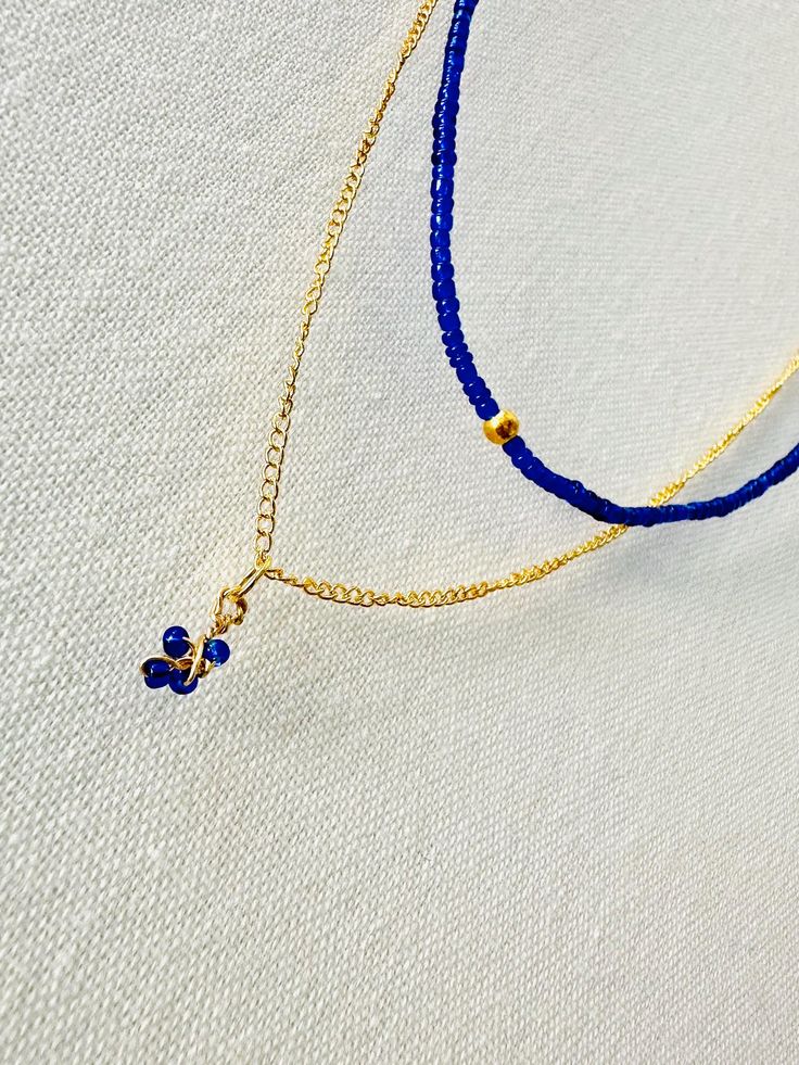 elegant blend of deep blue beads and delicate gold chain. Perfect for adding a touch of sophistication to any outfit, this piece effortlessly combines timeless charm with modern style. AVAILABLE IN ASORTED COLORS💅🏼   *free repairs available with return of original beads* Blue Beaded Necklace For Party, Blue Beaded Necklaces With Delicate Chain And Round Beads, Blue Beaded Necklaces With Tiny Beads For Party, Blue Beaded Necklace With Tiny Beads For Party, Blue Beaded Necklaces With Delicate Chain, Blue Party Beaded Necklace With Tiny Beads, Party Jewelry With Tiny Blue Beads, Dainty Blue Beaded Necklaces With Delicate Chain, Blue Beaded Everyday Necklace