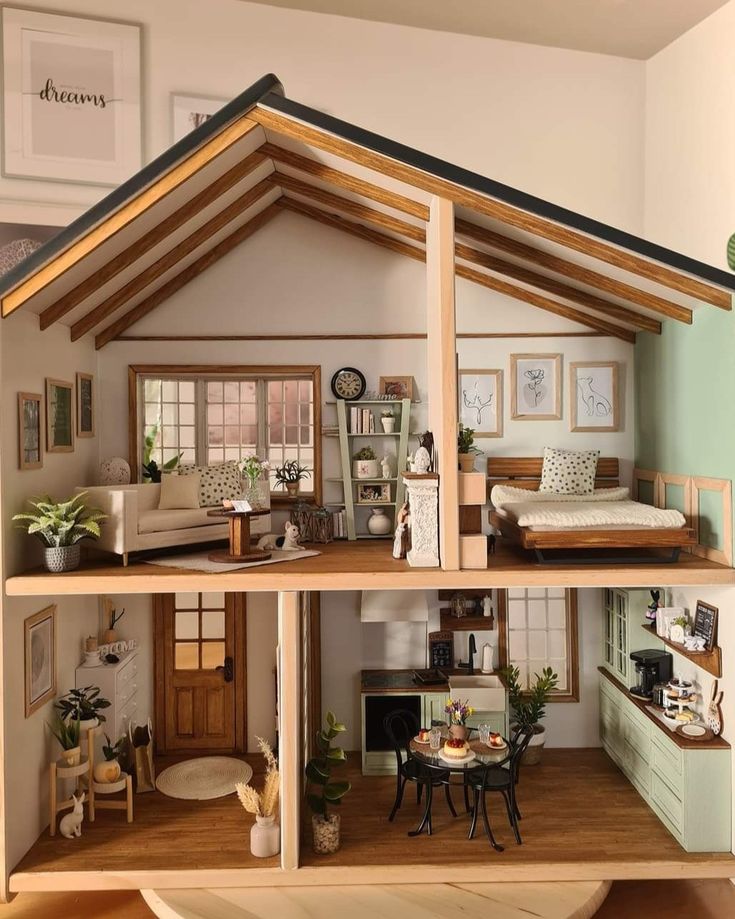 a doll house is shown with furniture and decor on the inside, as well as in the outside