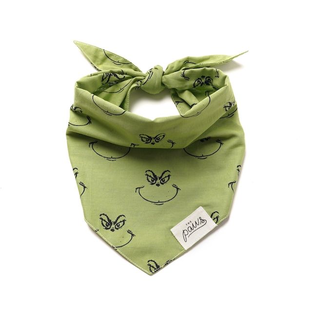 a green bandana with faces on it