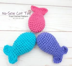 three crocheted fish sitting next to each other