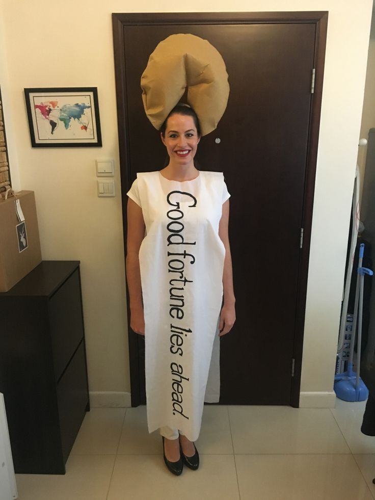 a woman standing in front of a door wearing a white dress with the words congratulations written on it