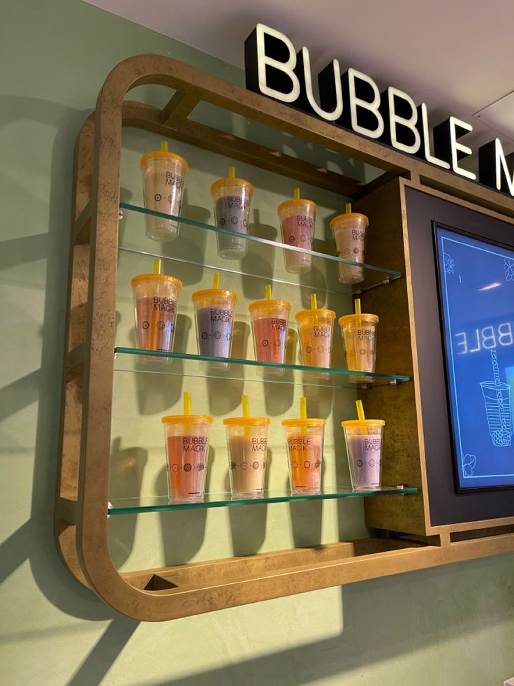 a display case filled with cups and drinks