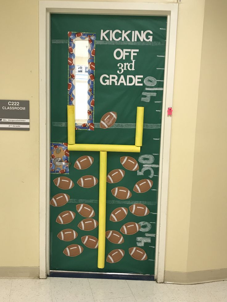 a door decorated with footballs and the words kicking off 3rd grade