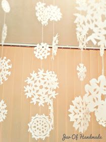 white snowflakes hanging from the ceiling