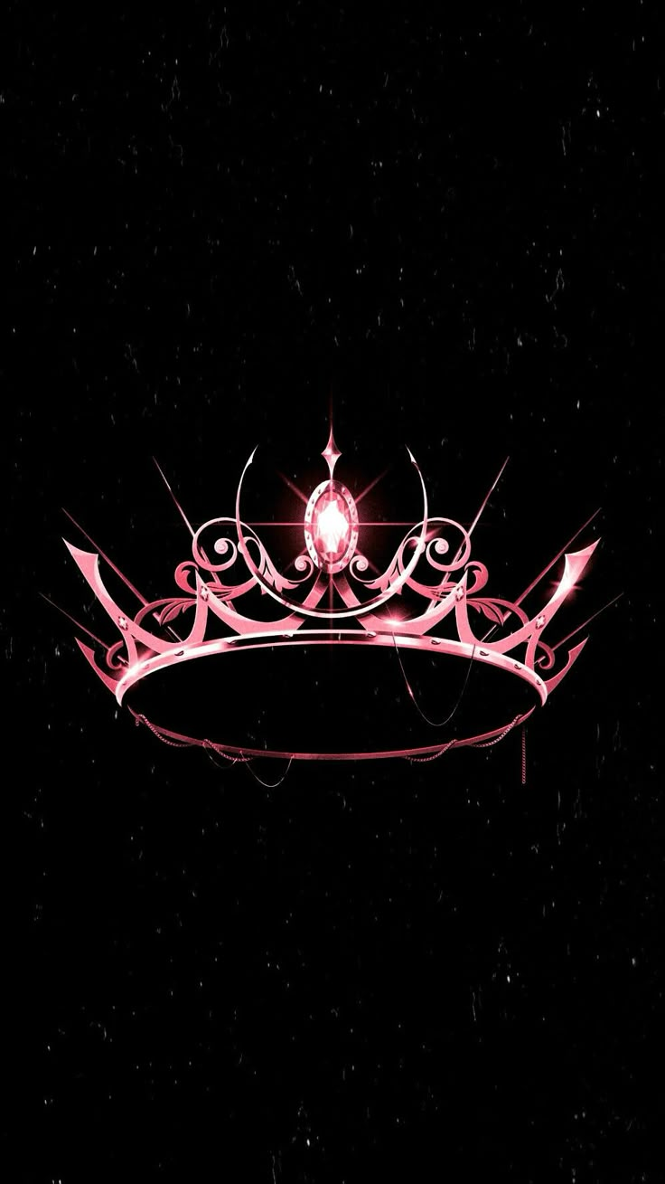 a pink tiara on a black background