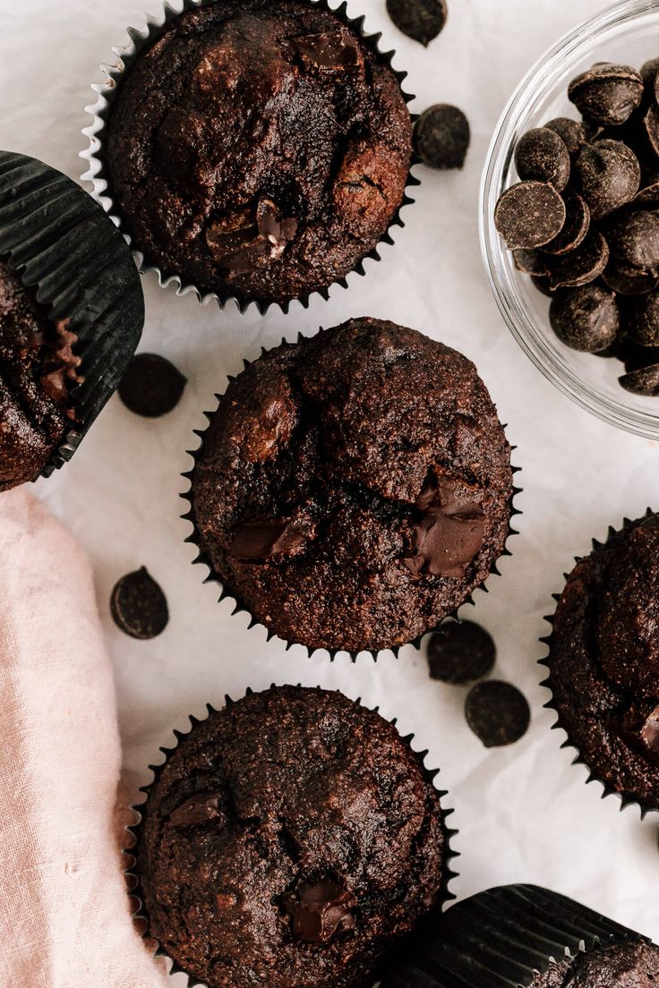 chocolate muffins with chocolate chips on the side