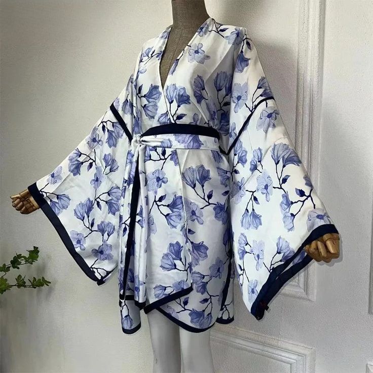 One Size fits S-3X/4X Material: Poly Silk (a lightweight, smooth, and shiny fabric that drapes and flows very well. An affordable alternative to silk) Fitted Wrap Kimono For Spring, Spring Fitted Wrap Kimono, Casual Silk Kimono For Spring, Casual Silk Spring Kimono, Fitted Spring Vacation Kimono, Blue Rayon Kimono For Spring, Blue V-neck Kimono For Spring, Fitted Blue Summer Kimono, Fitted Blue Kimono For Summer