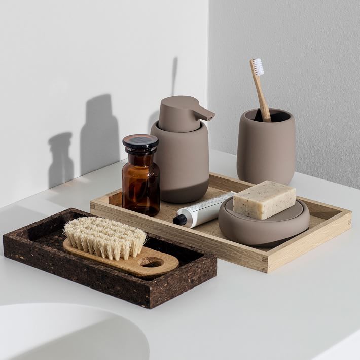 an assortment of bathroom items on a tray