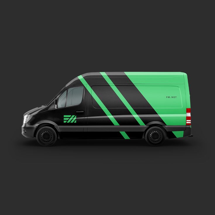 a black and green van with stripes on the side is shown in this studio shot