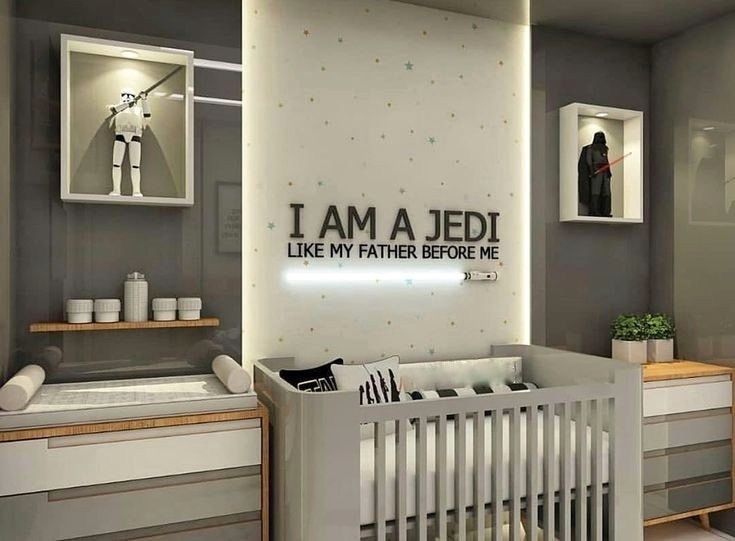 a baby's room with a crib, dresser and wall decal that says i am a jedi like my father before me