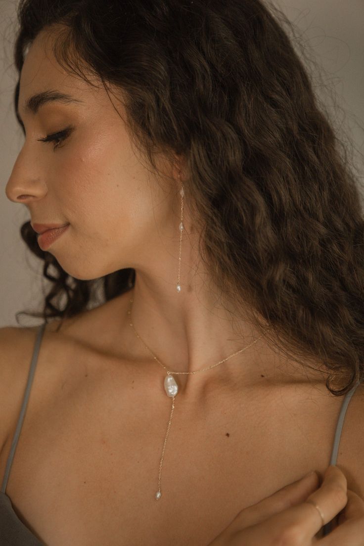 Inspired by the dreamy feeling of looking up into the clouds, the Cloud Collection reimagines historical jewelry elements resulting in timeless, airy, and whimsical jewelry that will have you floating on cloud nine. A freshwater pearl is not mined and shaped. It is born complete and lovely, beneath the water. Baroque pearls are especially "wabi sabi," beautiful in their asymmetry and each one of a kind. ﻿- 6mm freshwater pearls﻿- 18k Vermeil ﻿- About 3 1/2" long Delicate Pearl Pendant Dangle Earrings, Delicate Dangle Pearl Pendant Earrings, White 14k Gold Filled Drop Jewelry, White Delicate Jewelry Gift, White Ethereal Jewelry For Gifts, Minimalist Akoya Pearl Drop Earrings Jewelry, Ethereal Teardrop Jewelry As Gift, Ethereal Teardrop Jewelry Gift, 14k Gold Filled Pearl Drop Jewelry