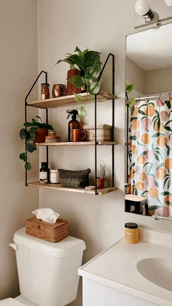 the bathroom is clean and ready to be used as a planter, toilet paper holder, and shower curtain