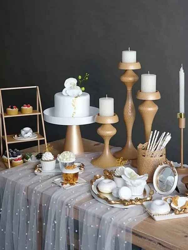 a table topped with lots of different types of cakes