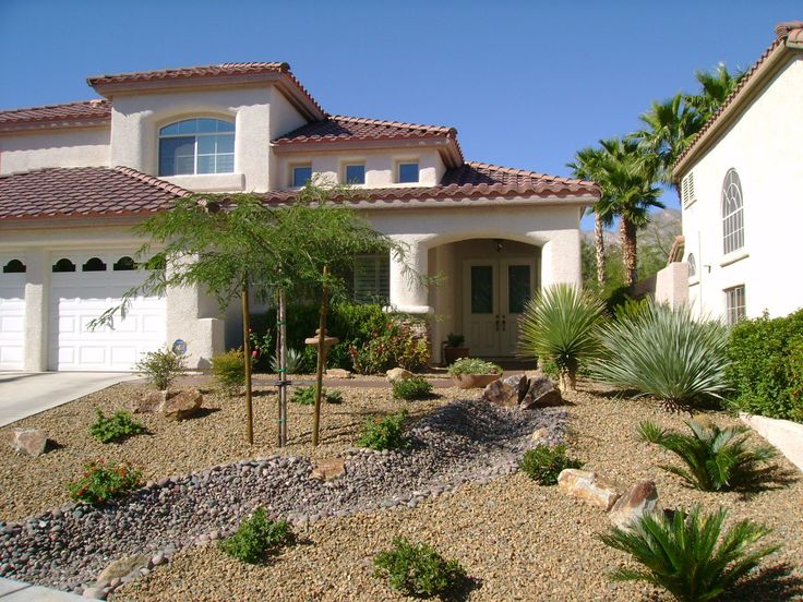 a house with landscaping in front of it