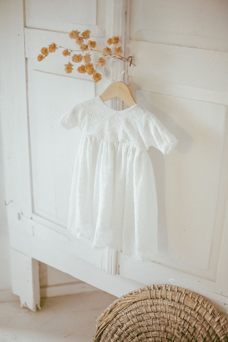 Introducing our timeless and adorable dress. Featuring a minimalistic design, this dress is perfect for any occasion. The dress is composed of two layers, guipure fabric and cotton, creating a beautiful and unique combination.  Our dress is perfect for any season and will make your child feel comfortable and stylish. Its classic design ensures that it will be a cherished item in your child's wardrobe for years to come. Features: - Timeless and adorable design  - Knee length and short sleeves - Two-layer composition: guipure fabric and cotton - Versatile for any occasion and season ❤ Shop Find more girls clothing here: https://www.etsy.com/shop/MatrinnaBoutique?ref=simple-shop-header-name&listing_id=1109004071&section_id=28396646 Find our full shop link here: https://www.etsy.com/shop/Matri Fitted Gown With Short Sleeves, Summer First Communion Dress With Lace Bodice, Summer Lace Bodice Dress For First Communion, White Short Sleeve Confirmation Dress, White Short Sleeve Dress For Confirmation, Elegant Short Sleeve Lace Dress With Ruffles, Fitted Lace Gown With Short Sleeves, Elegant Lace Dress With Ruffles And Short Sleeves, Fitted Lace Bodice Dress For First Communion