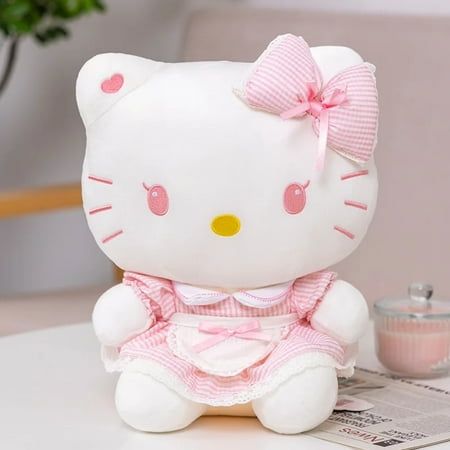 a hello kitty stuffed animal sitting on top of a table