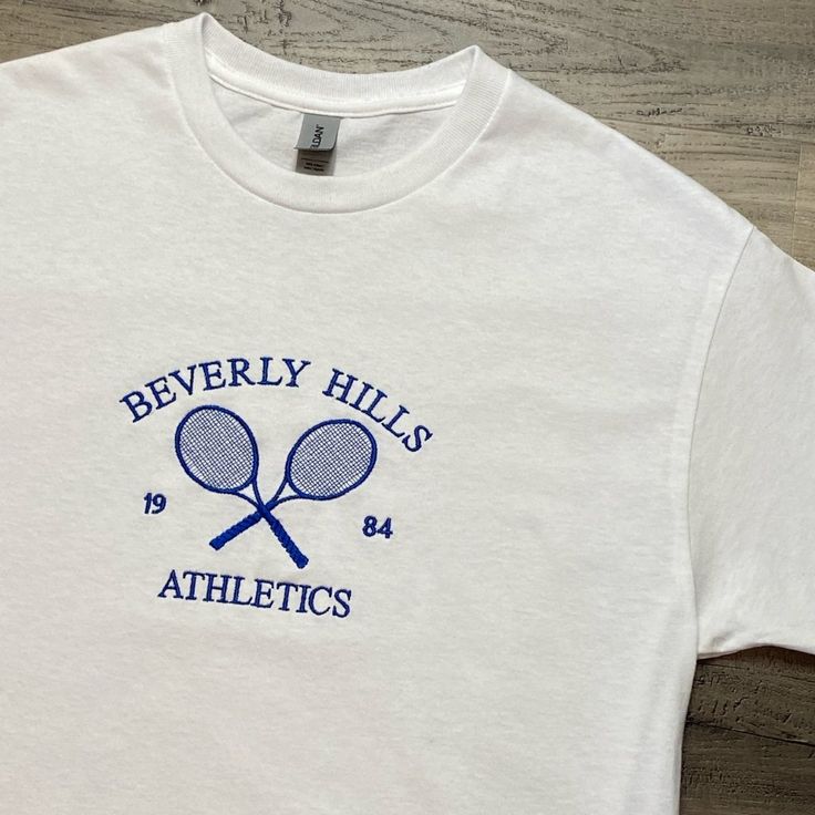 Mens Beverly Hills T-Shirt Size Large Fully Embroidered Brand New Without Tags Measurements- Pit To Pit 22 Inches Length 27 Inches Message For Questions Greek Life Formal Shirts, Sports Cotton T-shirt With Embroidered Graphics, Blue College T-shirt With Embroidered Logo, Sporty T-shirt With Embroidered Graphics And Relaxed Fit, Sporty Relaxed Fit T-shirt With Embroidered Graphics, Sporty T-shirt With Embroidered Text For College, Cotton Short Sleeve T-shirt For Tennis, Summer Cotton Tennis T-shirt, White Embroidered T-shirt For College