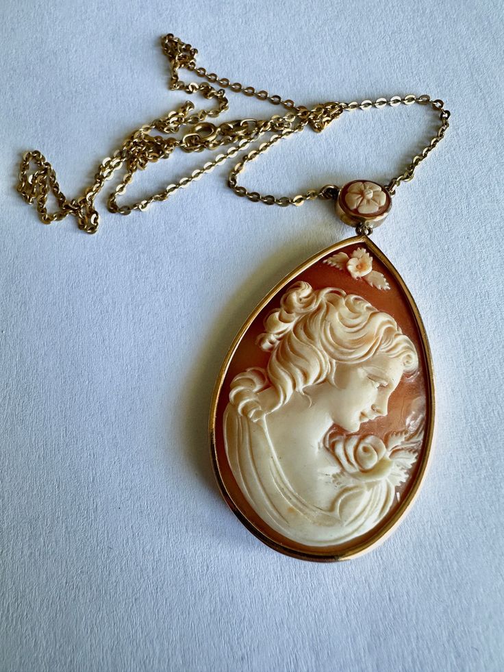 Gorgeous antique cameo set it in 18k gold with a y set chain. The cameo and the chain are stamped 18k gold. Luxury Gold Cameo Jewelry, Antique Formal Necklace With Oval Pendant, Antique Yellow Gold Necklace With Cabochon, Luxury Cameo Pendant Jewelry, Luxury Gold Cameo Necklace, Antique Oval Pendant Necklace For Formal Occasions, Elegant Cameo Necklace For Formal Occasions, Elegant Oval Pendant Necklace For Collectors, Heirloom Style Cameo Medallion Necklace