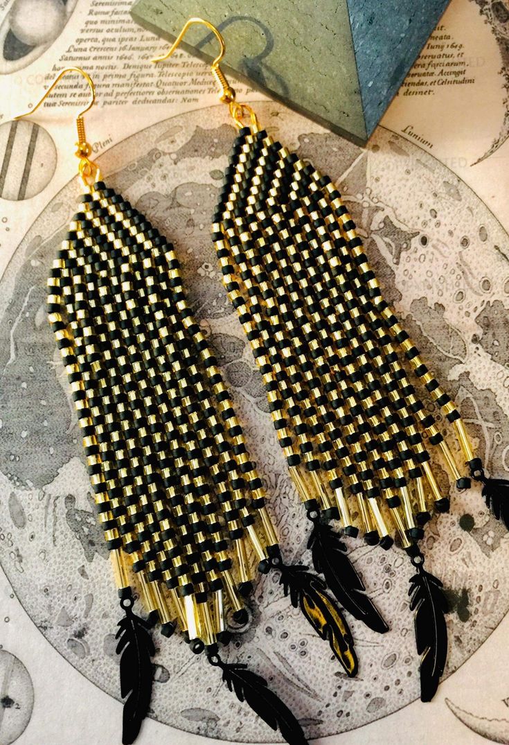 ✨handmade native style fringe earrings with metal black feathers️ Bohemian Black Feather Earrings, Black Feathered Jewelry For Festivals, Black Beaded Fringe Dangle Tassel Earrings, Black Beaded Fringe Tassel Dangle Earrings, Black Beaded Fringe Tassel Drop Earrings, Black Beaded Earrings With Fringe For Festival, Black Beaded Fringe Earrings For Festival, Handmade Black Chandelier Earrings For Festival, Black Bohemian Jewelry With Tassels