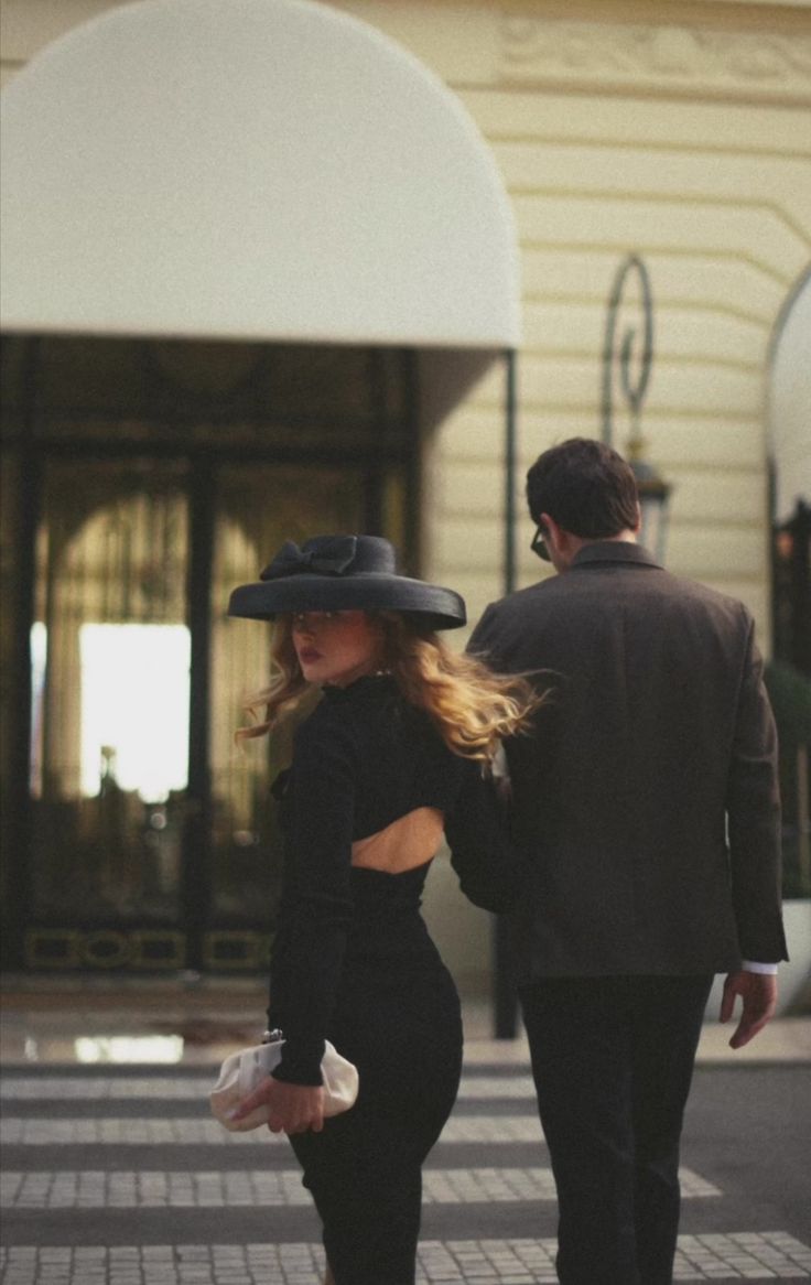 a man and woman walking down the street