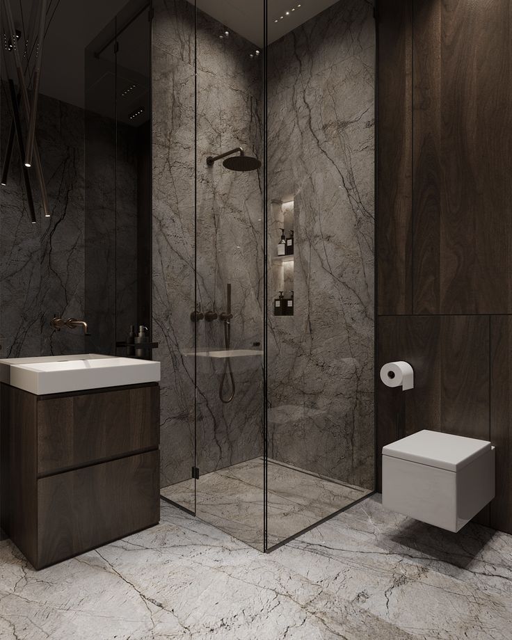 a modern bathroom with marble walls and flooring