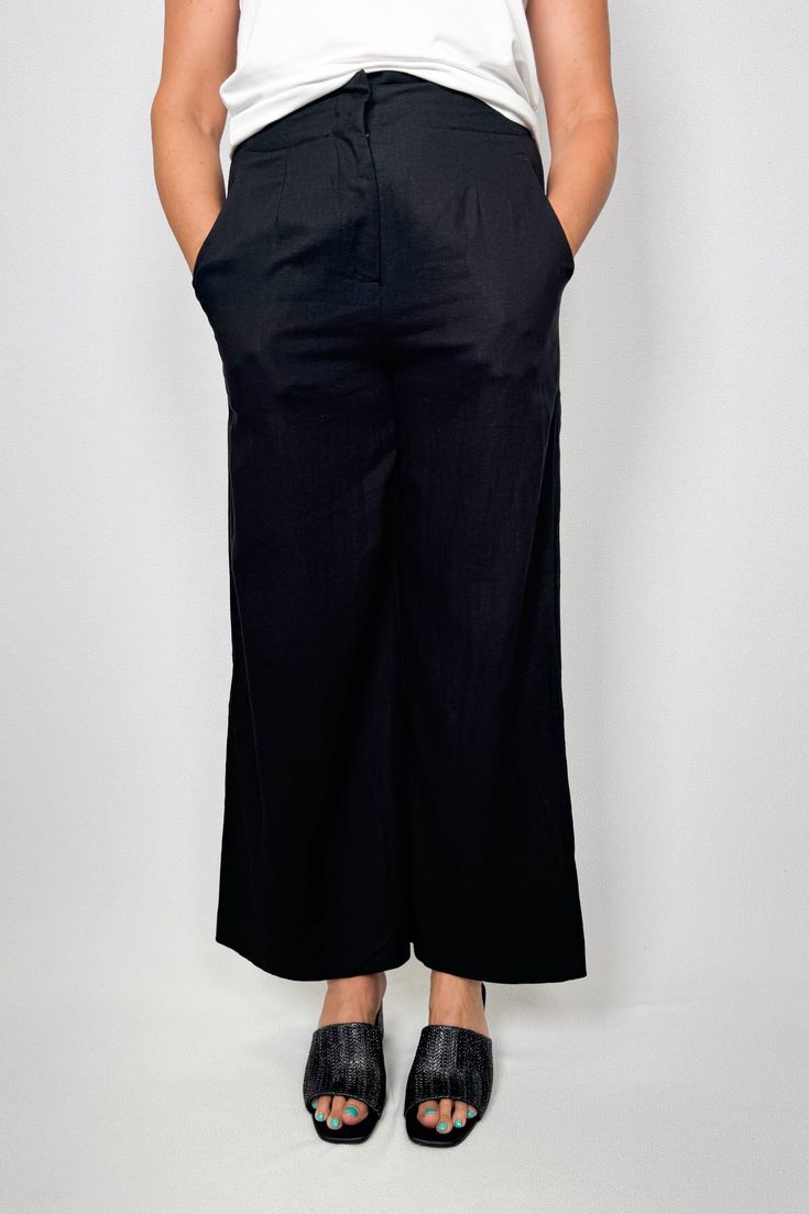 These pants are all about style and comfort with their wide leg fit and linen/viscose fabric. They feature a fly front opening, cut away pockets, and are full length. Get ready to rock a trendy and relaxed look with these fabulous pants. They're perfect for any occasion! Wide leg fit Fly front opening Cut away pockets Full length 65% Linen / 35% Viscose Care Instructions: Machine wash cold, inside out and lien dry in shade Item# BT7101-1 Summer High-waisted Wide Leg Viscose Pants, Black Viscose Pants For Summer, Versatile Wide Leg Linen Pants, Summer Black Viscose Pants, Black Viscose Wide Leg Pants For Spring, Chic Wide Leg Linen Pants, Chic Wide Leg Viscose Bottoms, Rayon Wide Leg Pants With Pockets, Summer Workwear Wide Leg Viscose Pants