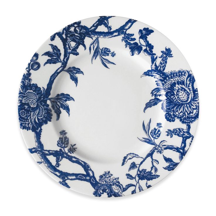 a blue and white plate with flowers on it